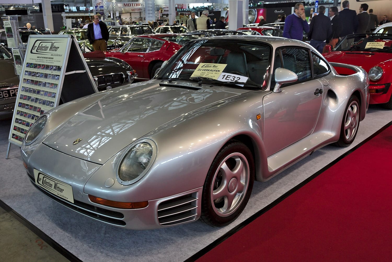 Silver Porsche 959 S on a trade show stand